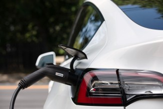 Enphase EV charger plugged in to a car