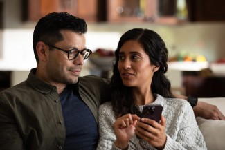 couple holding cell phone
