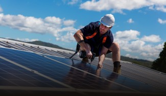 solar panel installer on roof