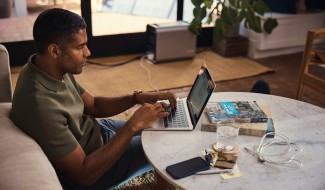 man working at home on laptop