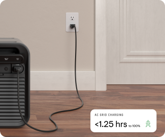 Portable energy system plugged into wall outlet for AC charging