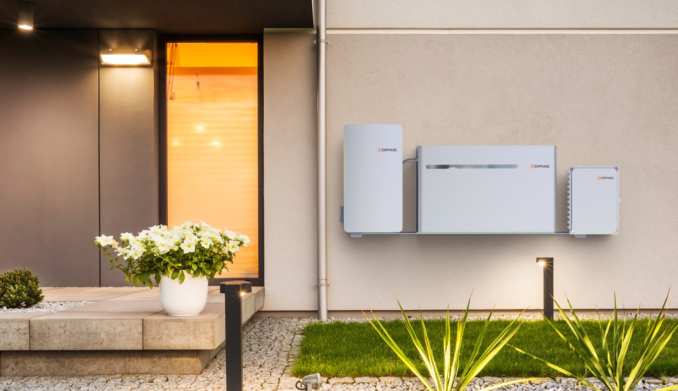 Enphase IQ combiner mounted on model home