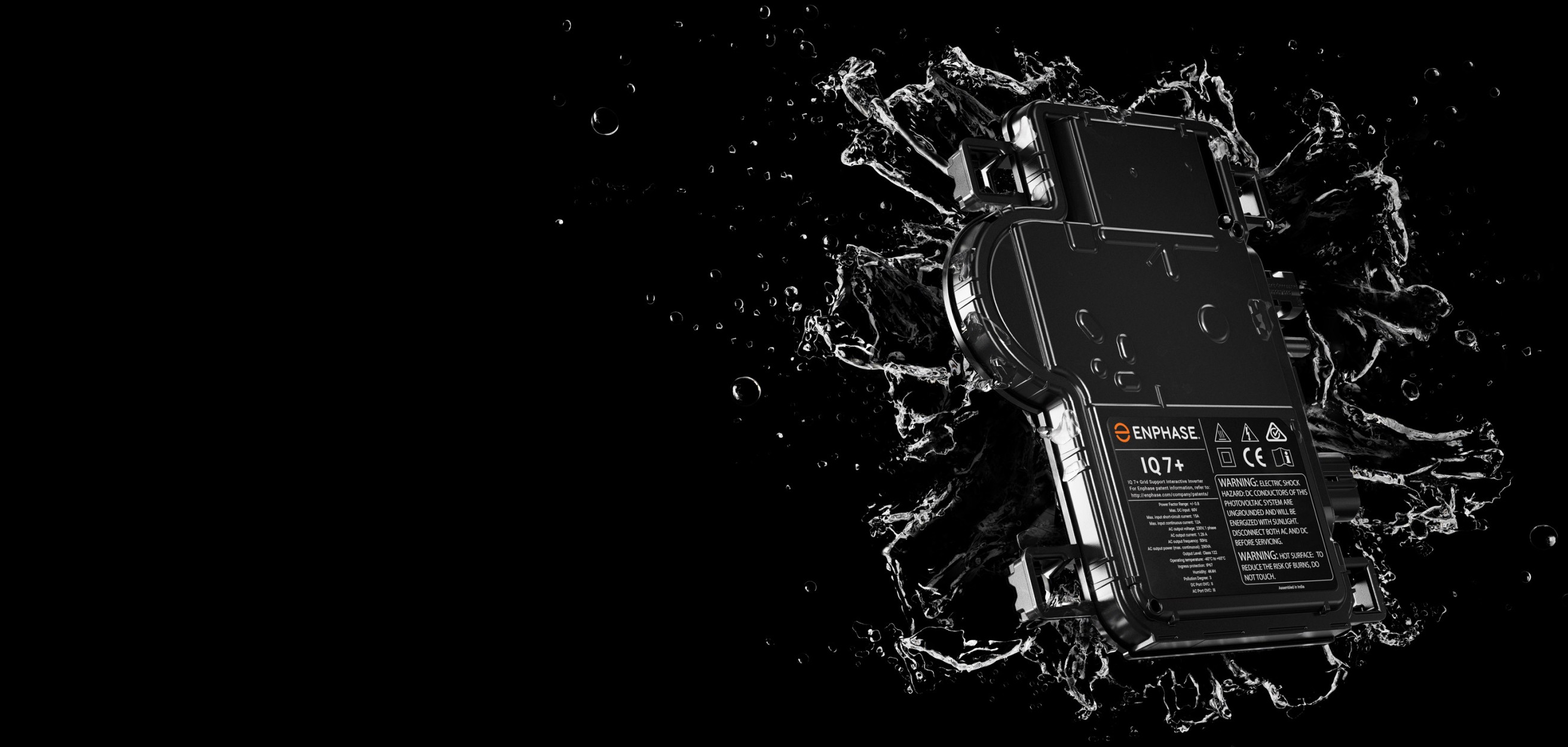 Enphase micro-inverter being splashed with water, creating a captivating visual effect.