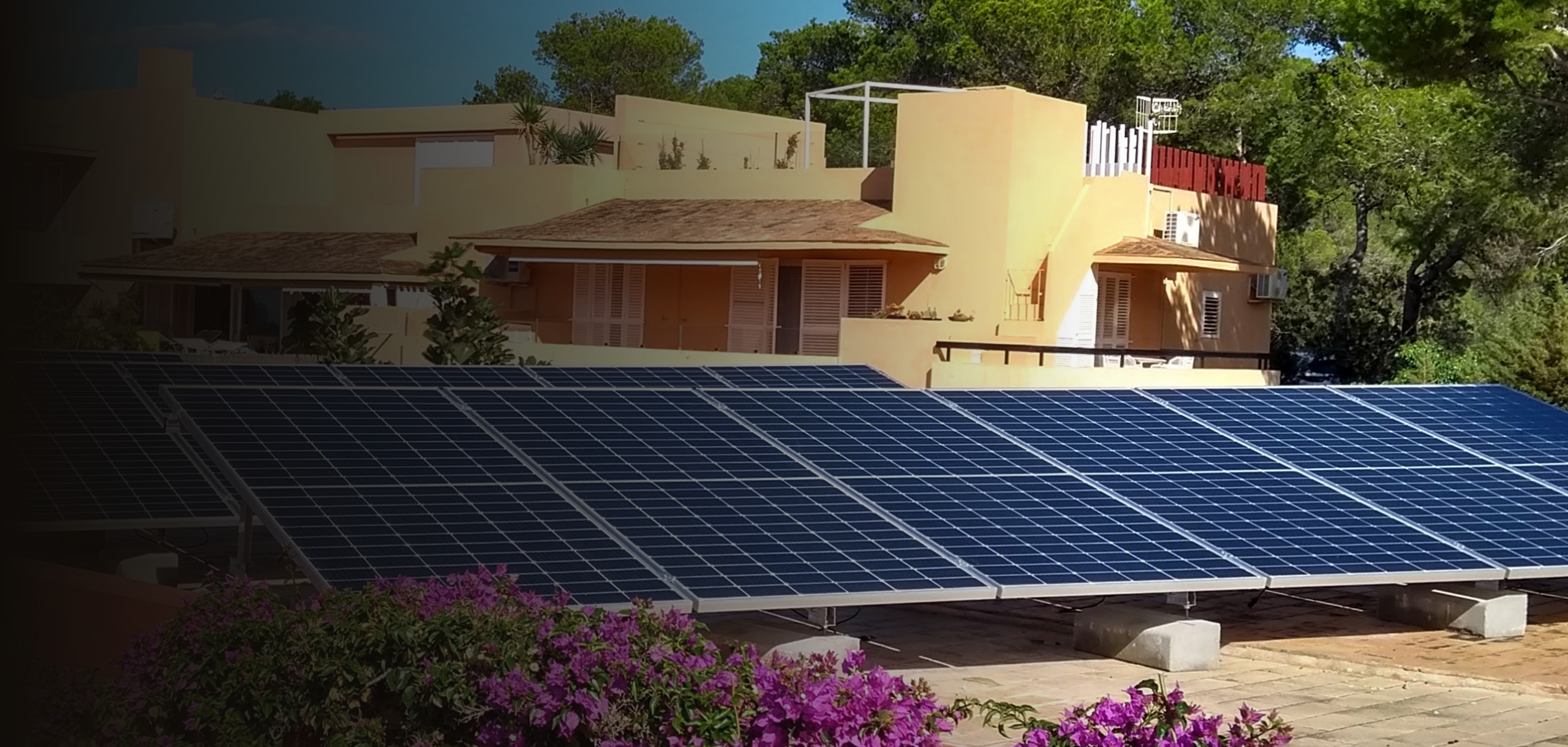 Stucco house with ground mount solar array in front