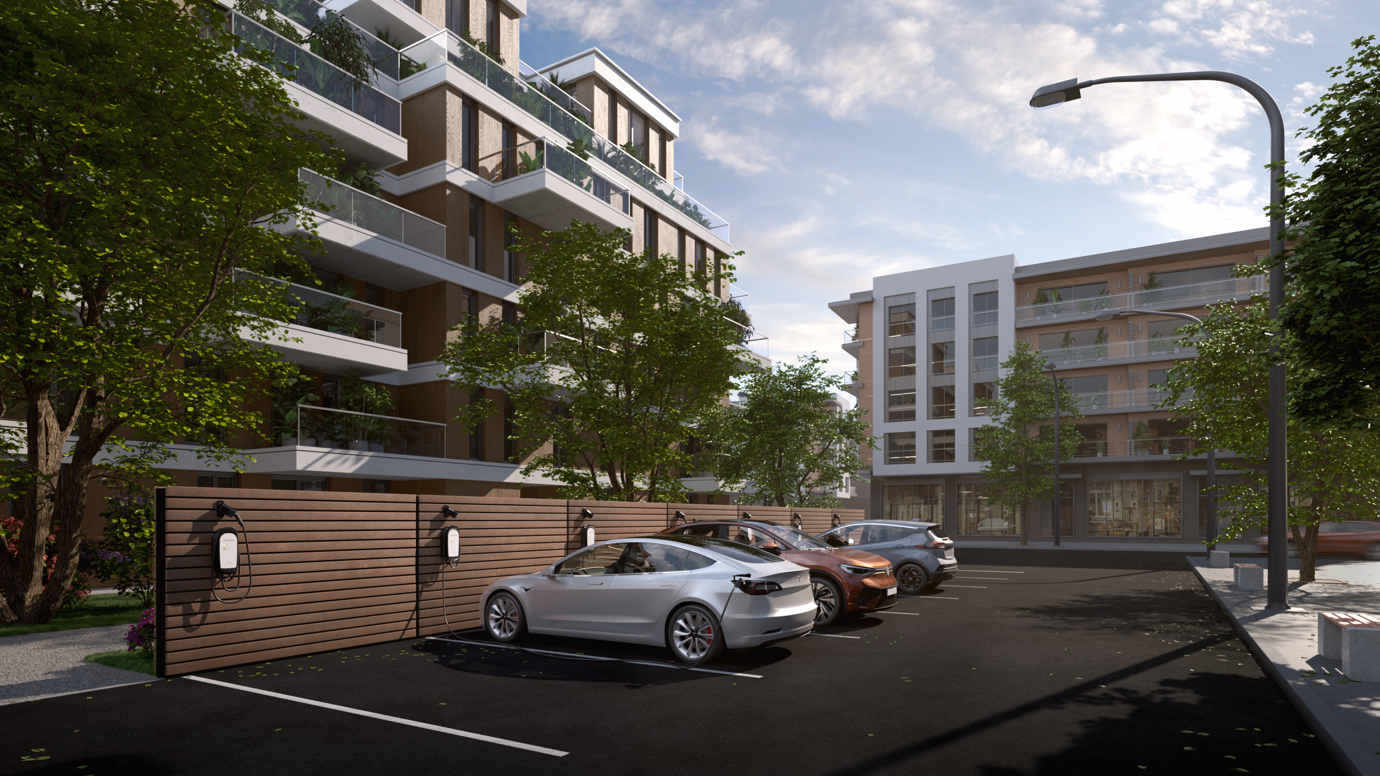 Cars parked at EV charging station outside apartments