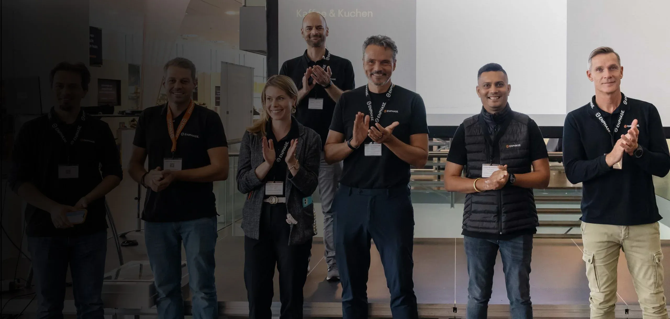 Lineup of people applauding 
