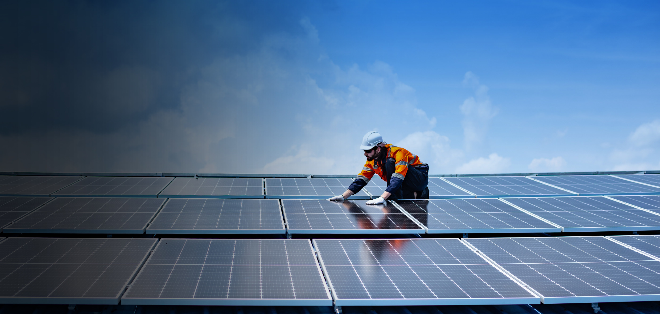 Installer on rooftop installing panels